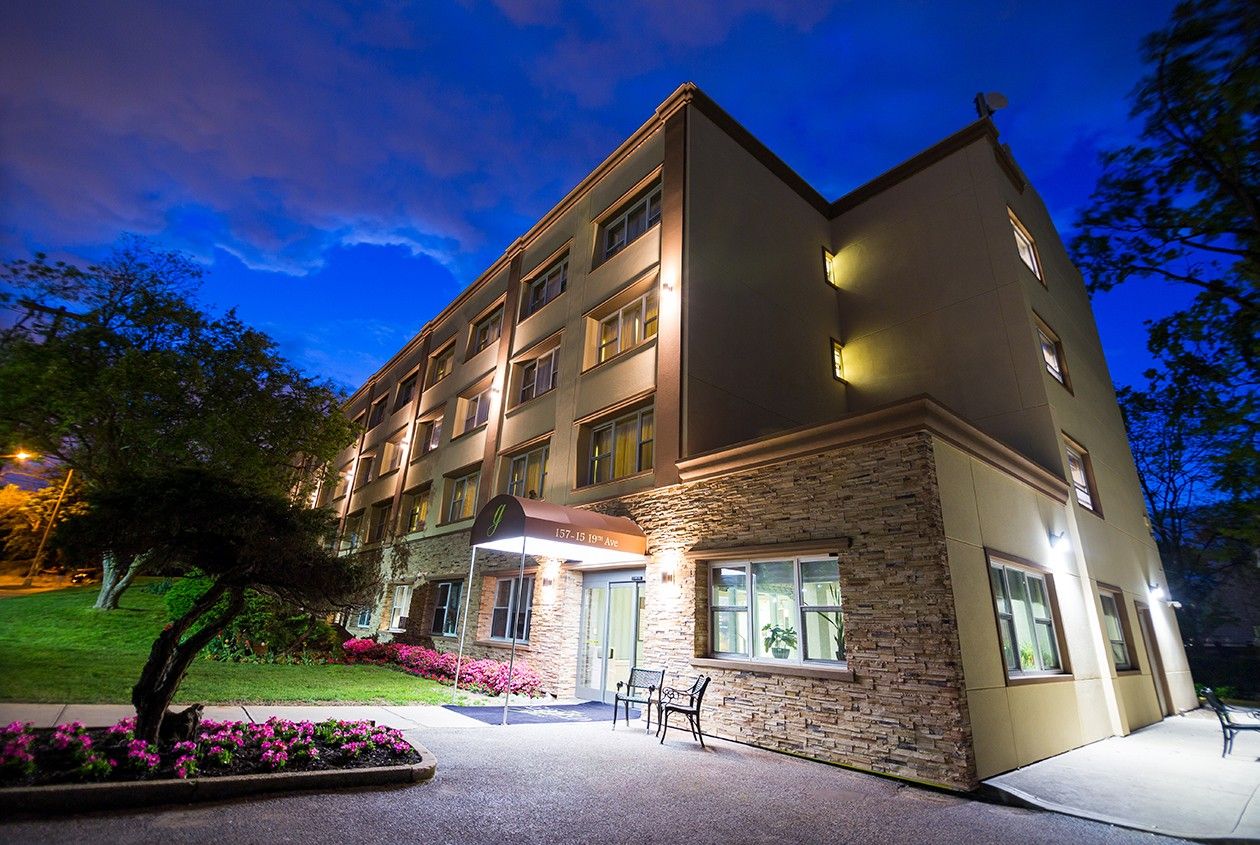 Exterior view of the assisted living facility at night