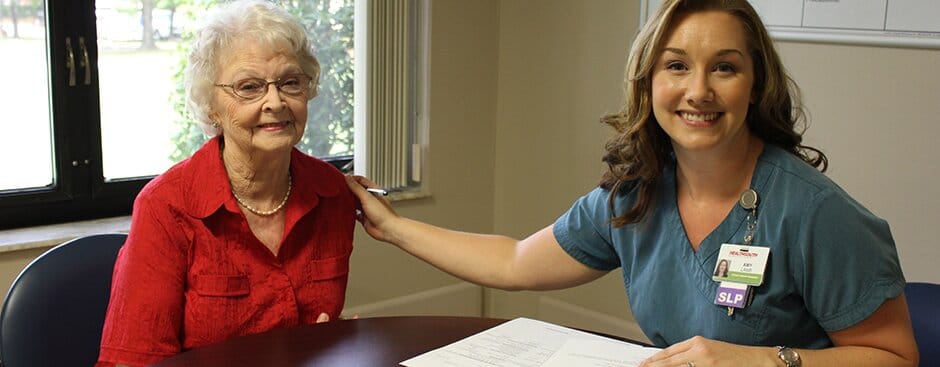 A staff member interacting with a resident during therapy