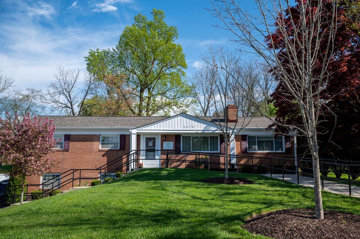 Exterior view of a senior living facility with landscaping