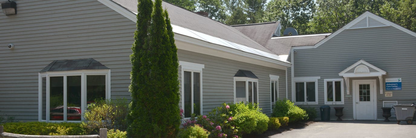 Exterior view of a senior living facility with landscaping