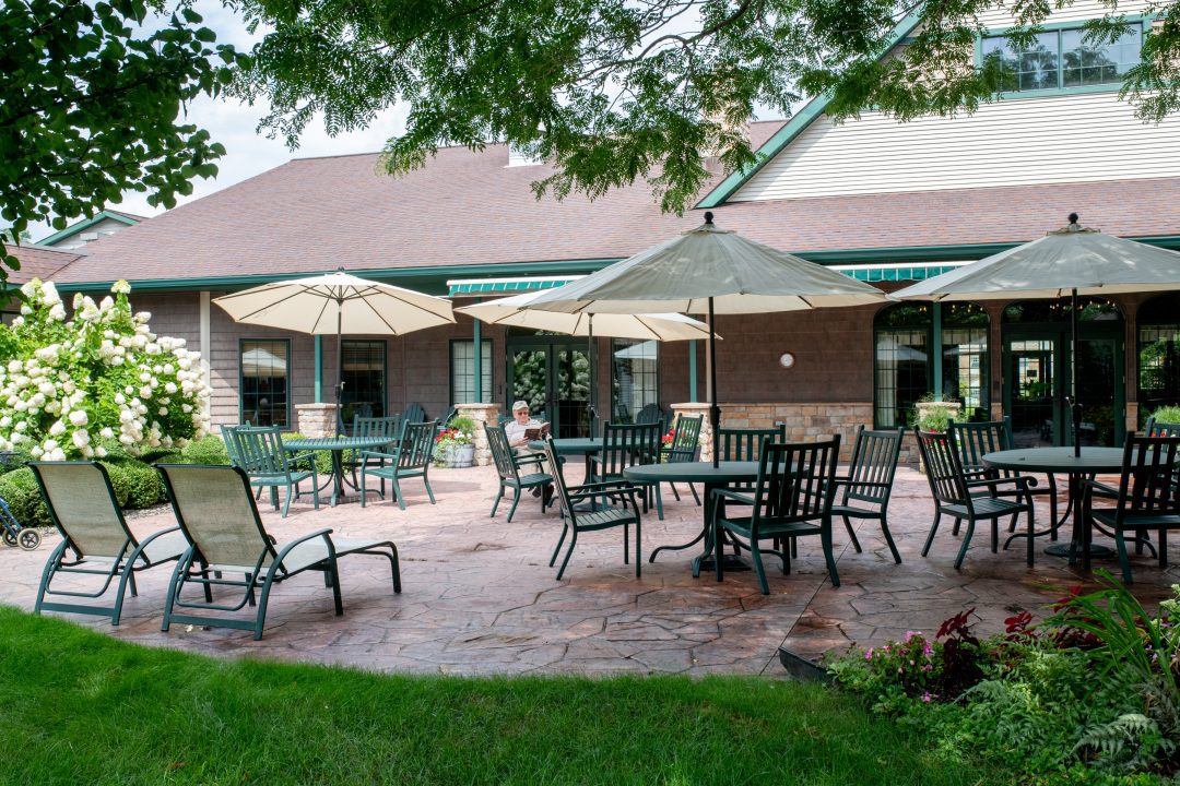 Outdoor patio area with seating and umbrellas