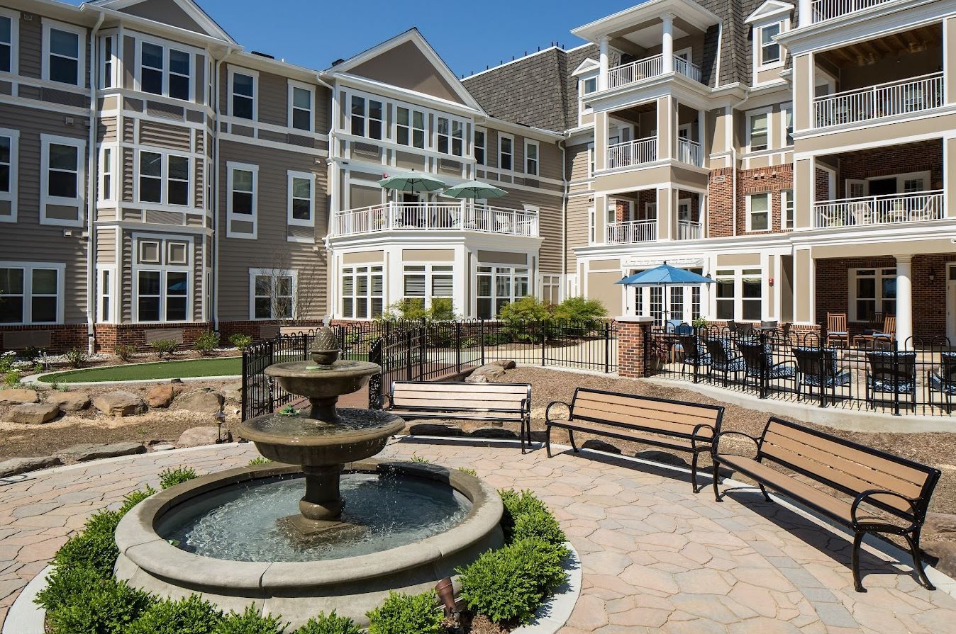 A serene courtyard with a fountain and seating