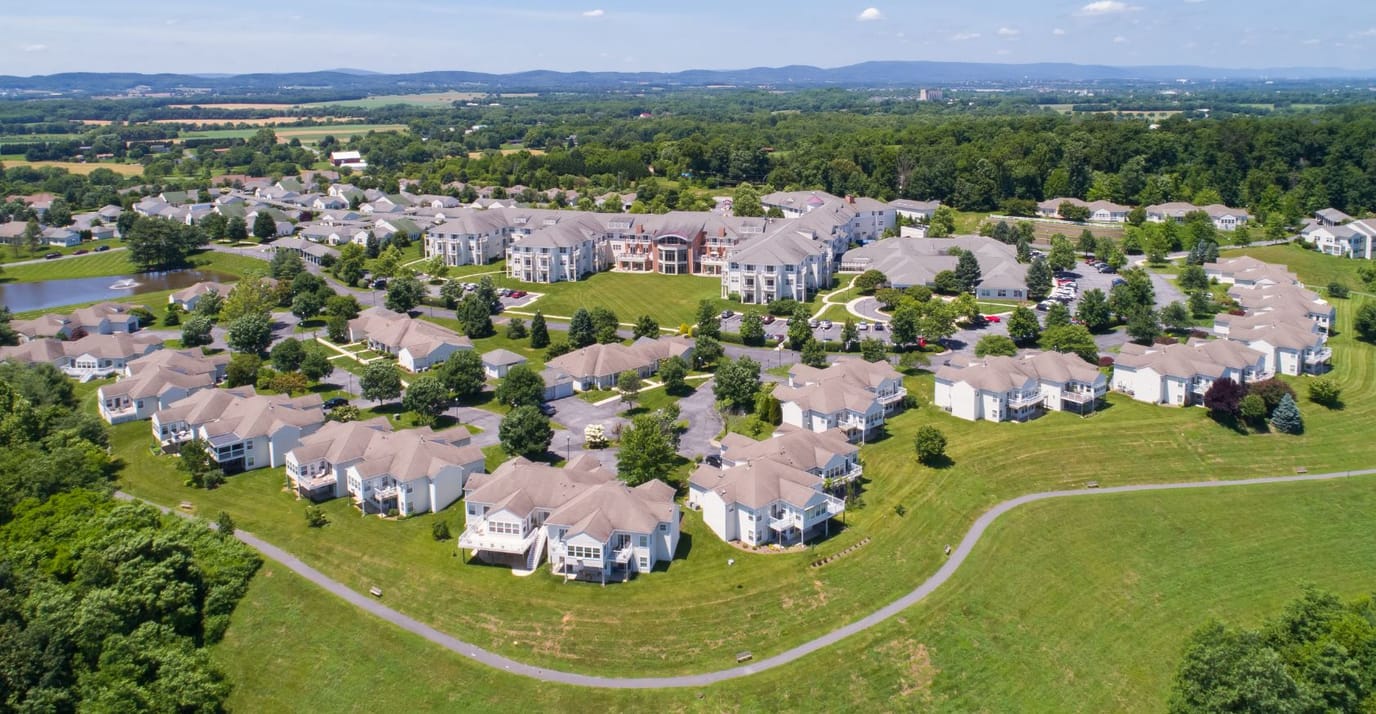 Aerial view of a senior living community with residences and landscaping