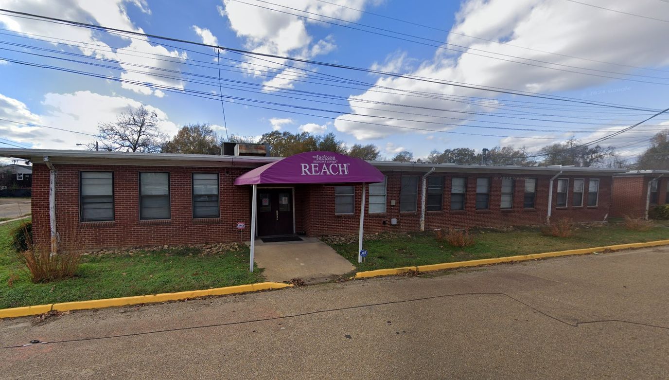 Exterior view of the facility with purple awning