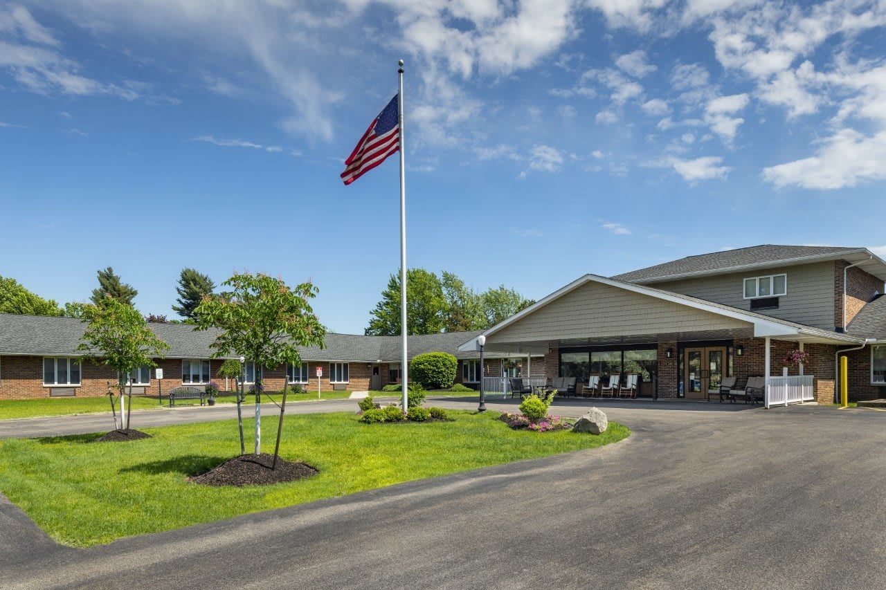 Exterior of assisted living facility with landscaped entrance