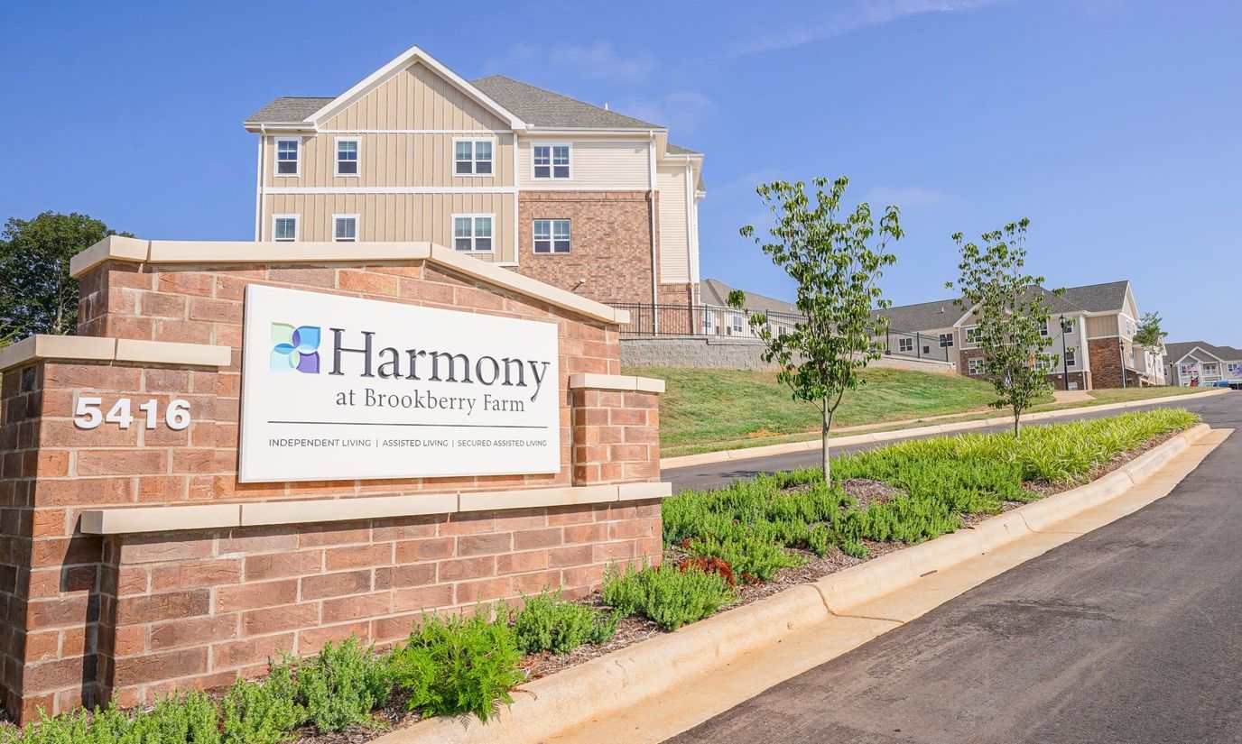 Exterior view of Harmony at Brookberry Farm, showing the building and sign.