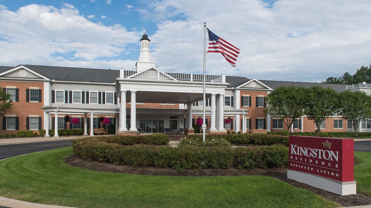 Exterior view of Kingston Residence building with flag