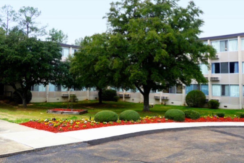 Exterior view of the facility with landscaped garden