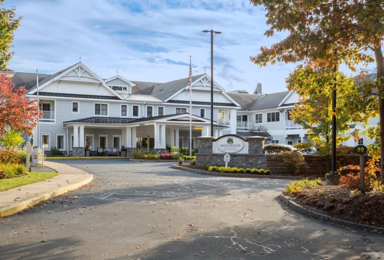 Exterior view of Maplewood at Weston surrounded by trees