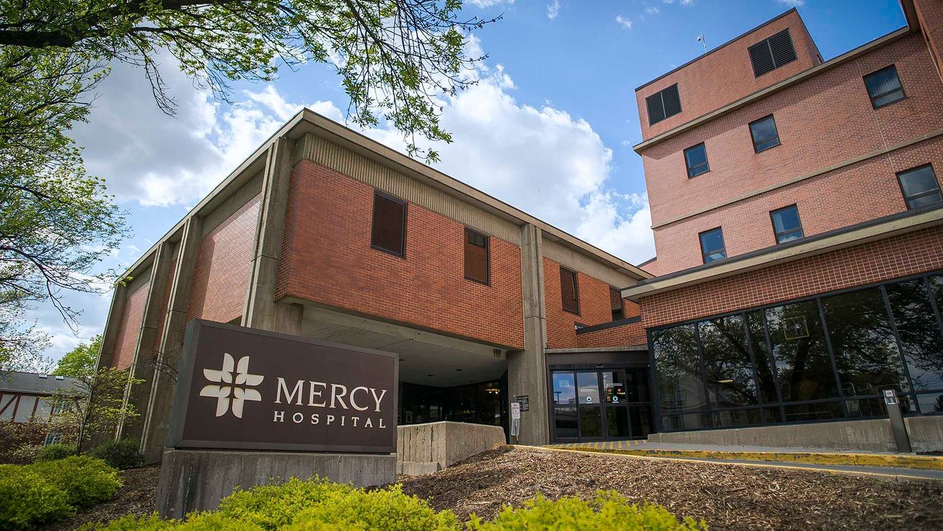 Exterior view of Mercy Hospital building with signage
