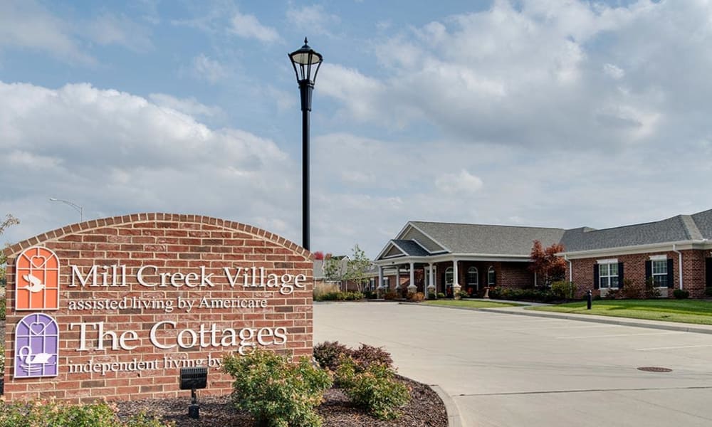 Exterior view of Mill Creek Village with signage