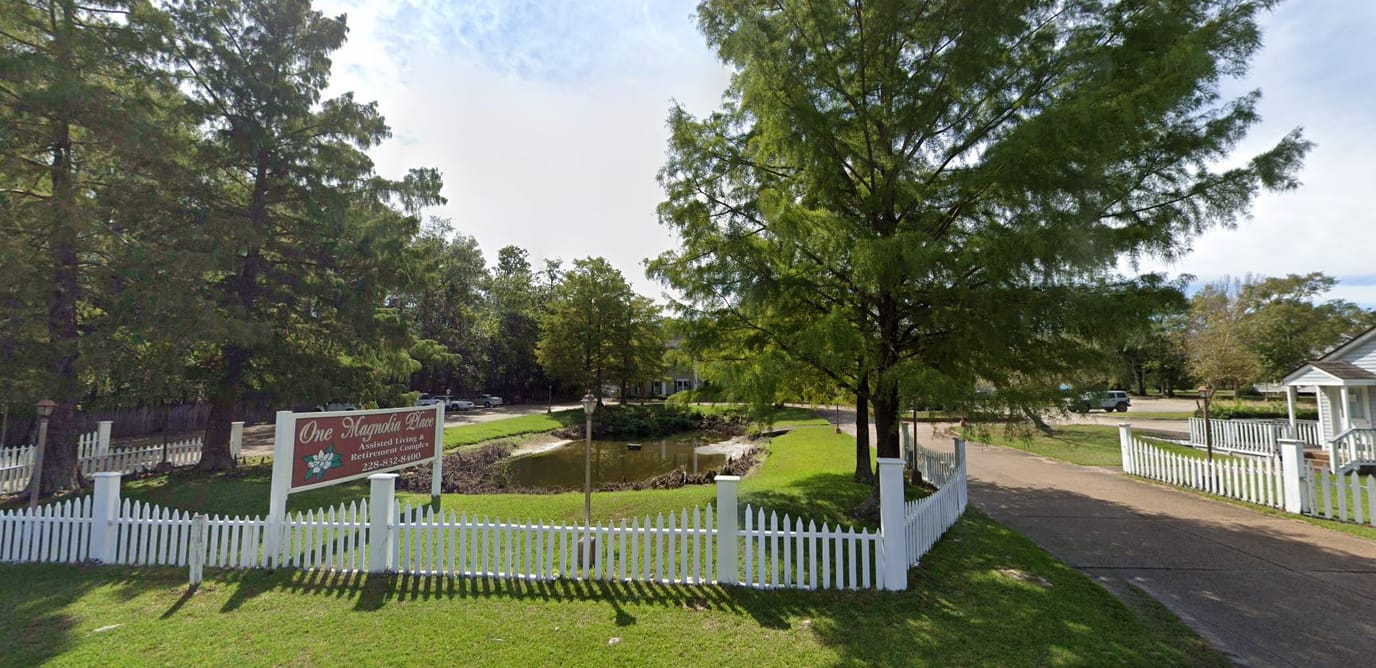 Exterior view of One Magnolia Place entrance and landscaping