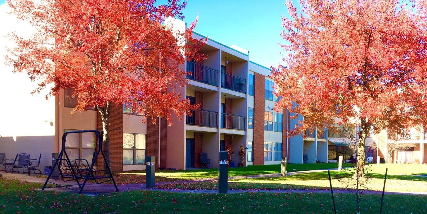 Exterior view of the assisted living facility in autumn