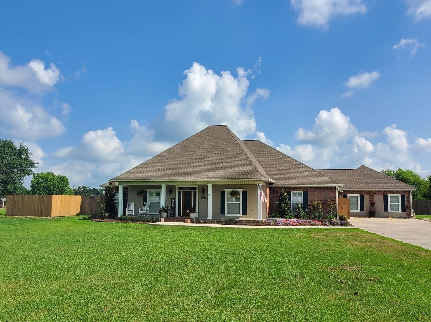 Exterior view of a senior living facility with garden