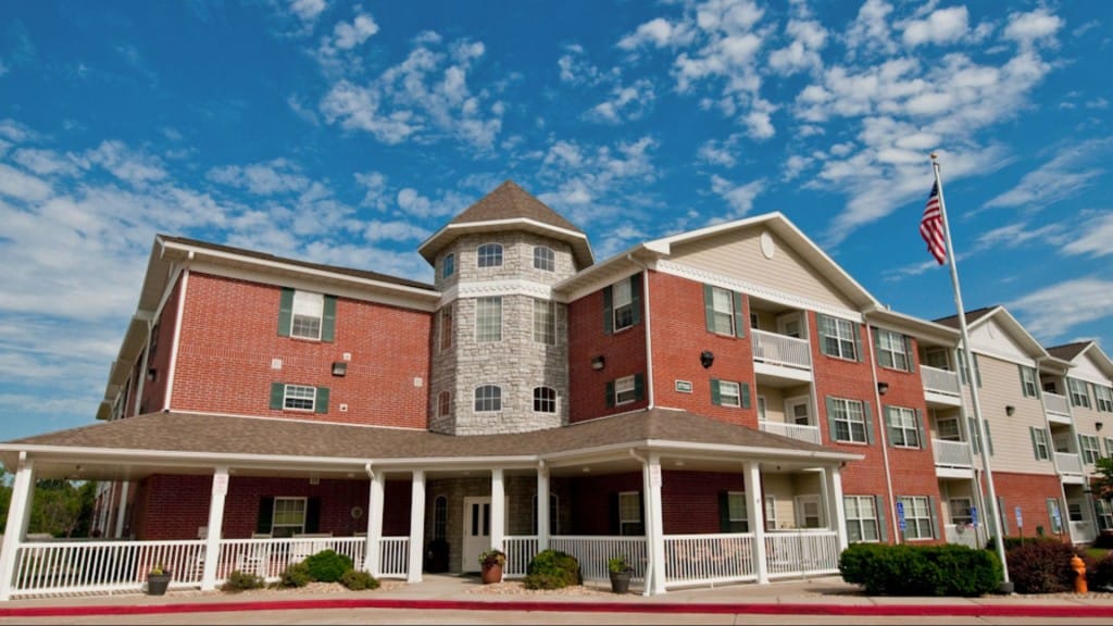 Exterior view of Regency Manor with blue skies