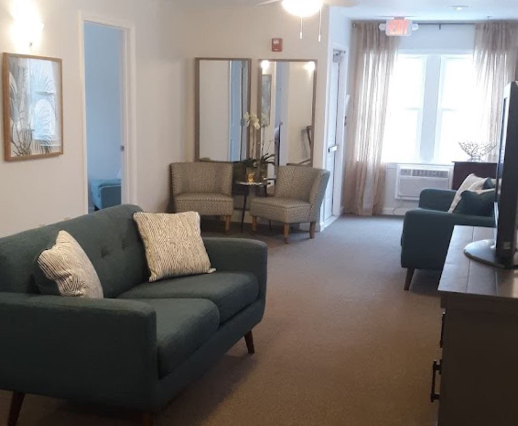 Common area with seating and natural light