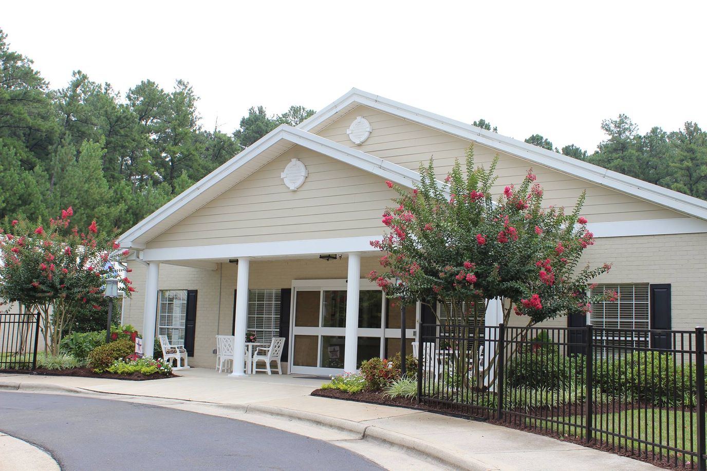 Exterior view of a senior living facility with flowers