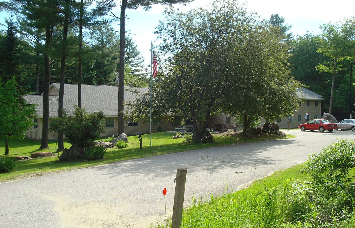 Exterior view of a nursing home surrounded by trees