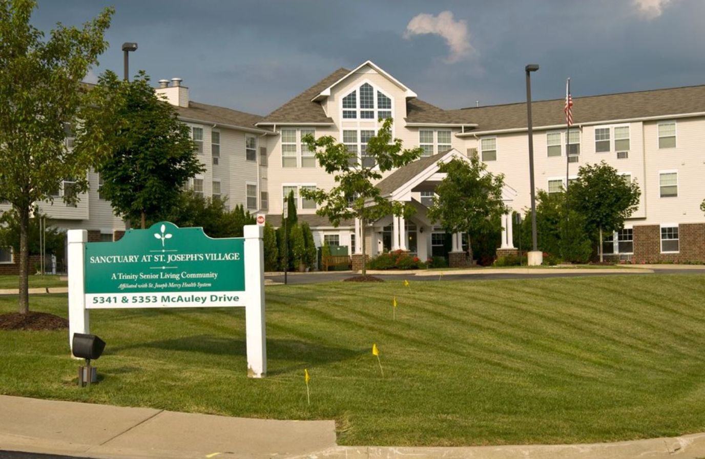Exterior view of St. Joseph Village with signage