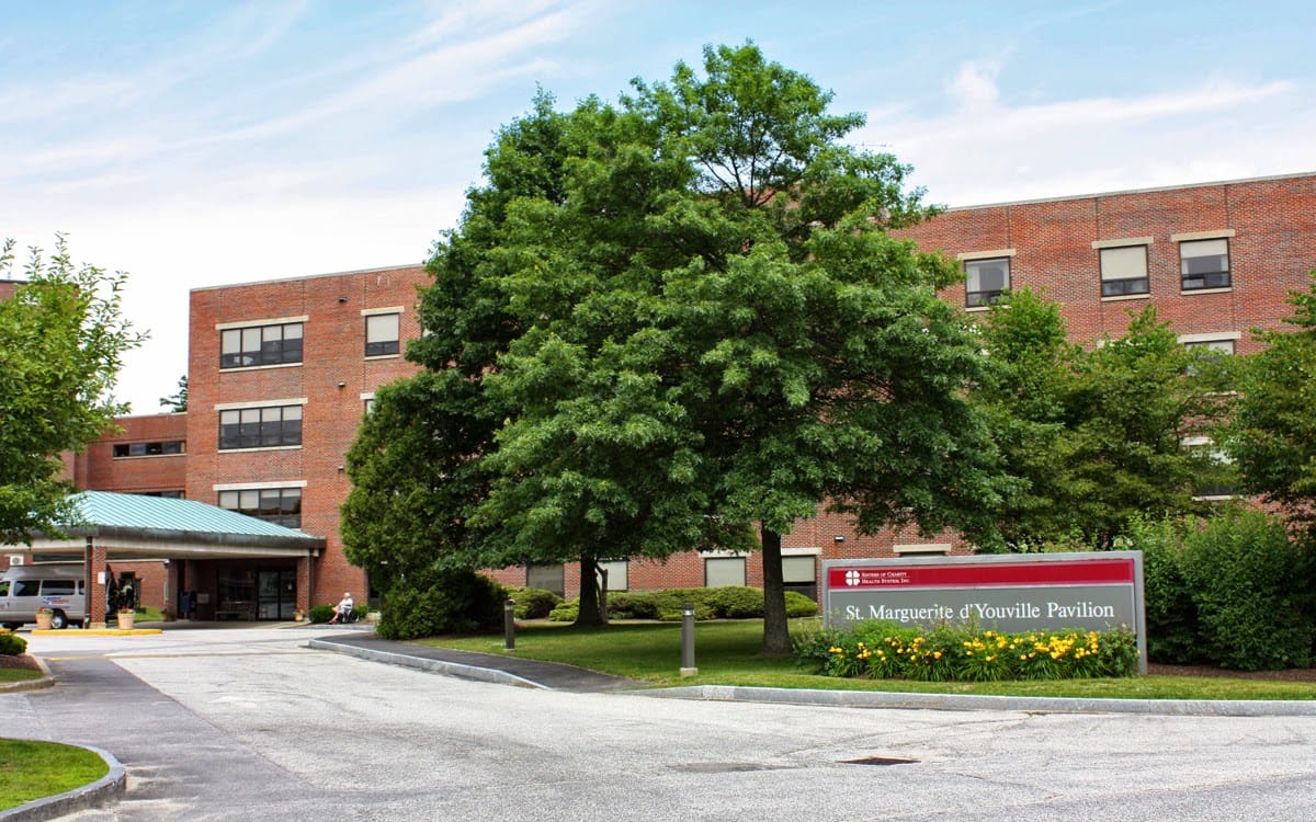 Front view of St. Marguerite d'Youville Pavilion with greenery