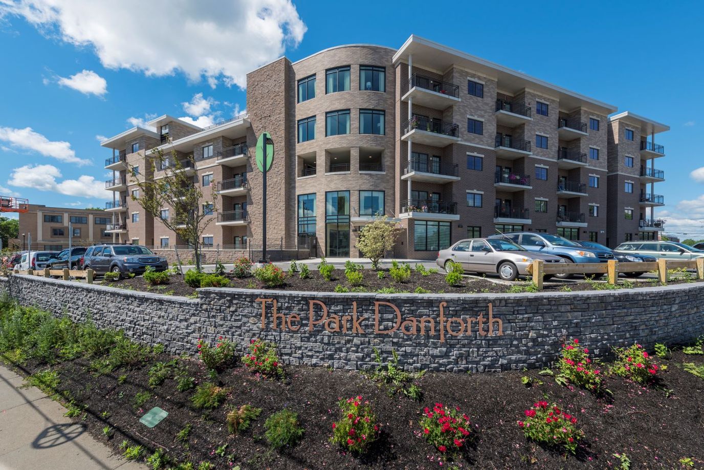 Exterior view of The Park Danforth building with landscaping