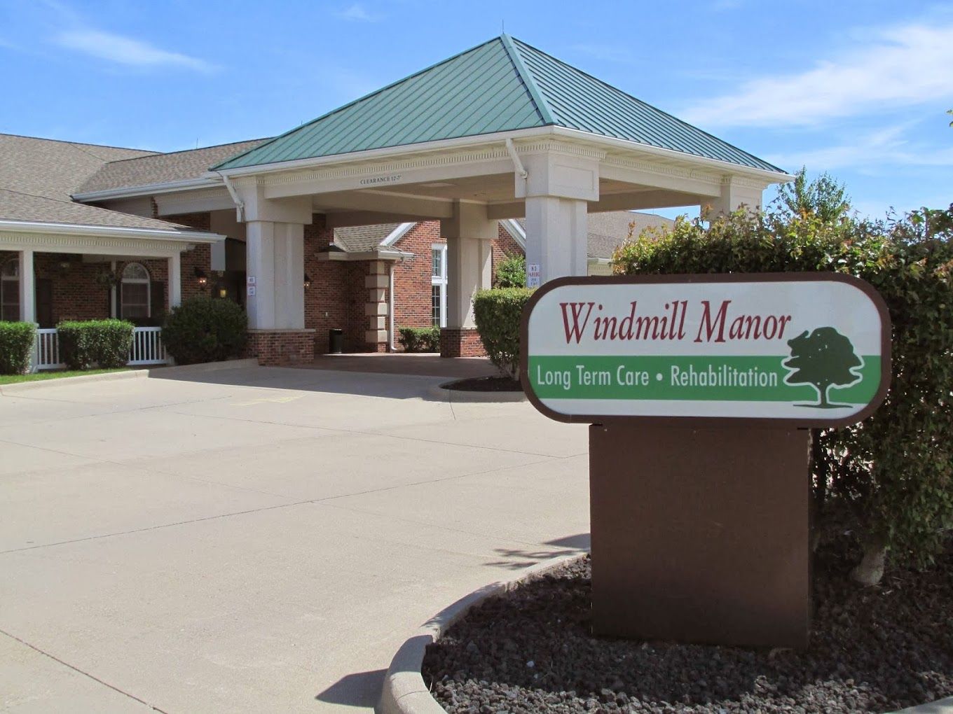 Exterior view of Windmill Manor entrance and signage