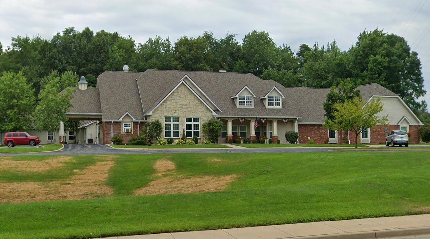 Exterior view of the assisted living facility with landscaping