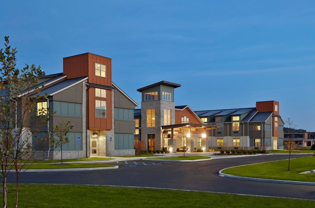 Exterior view of Wellbrooke of South Bend facility at dusk