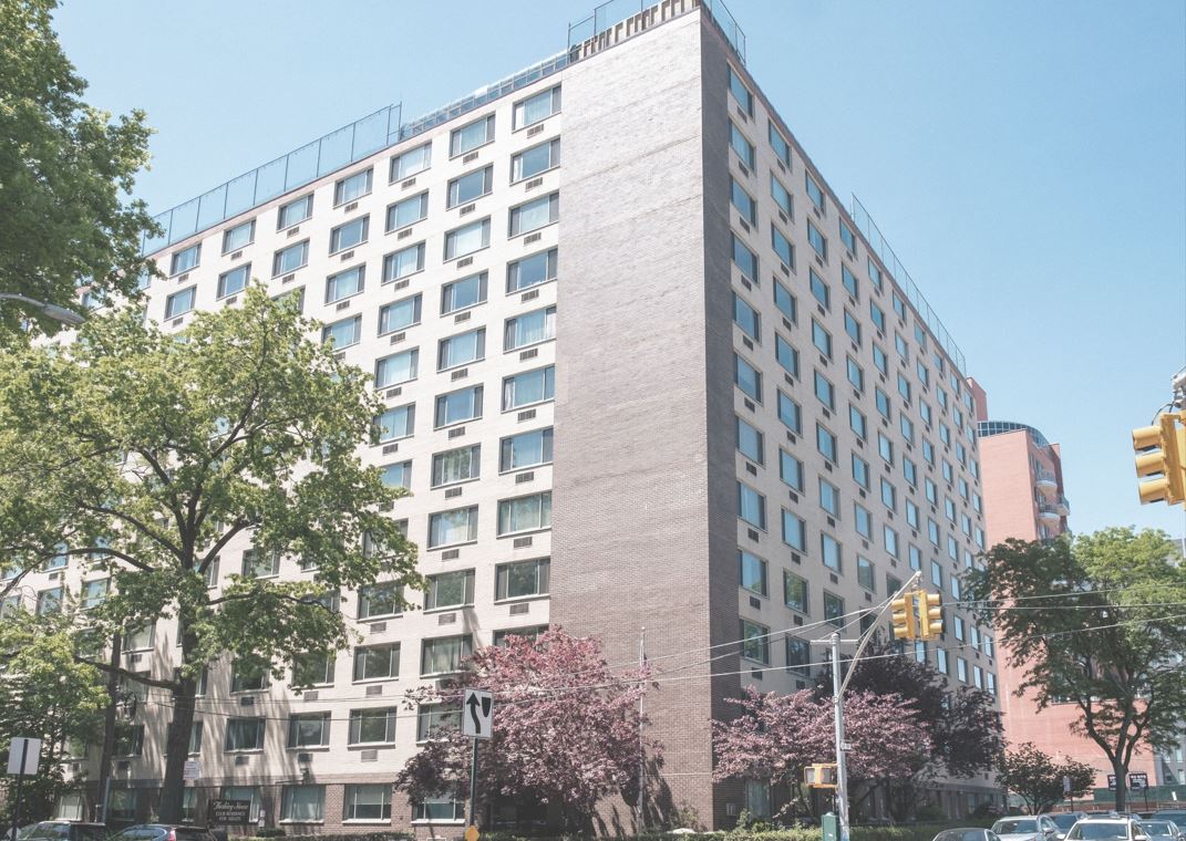 Exterior view of Flushing House with greenery