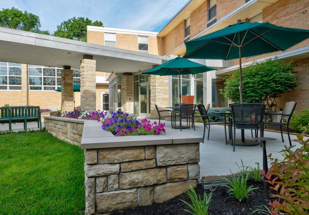 Outdoor courtyard with seating and flowers