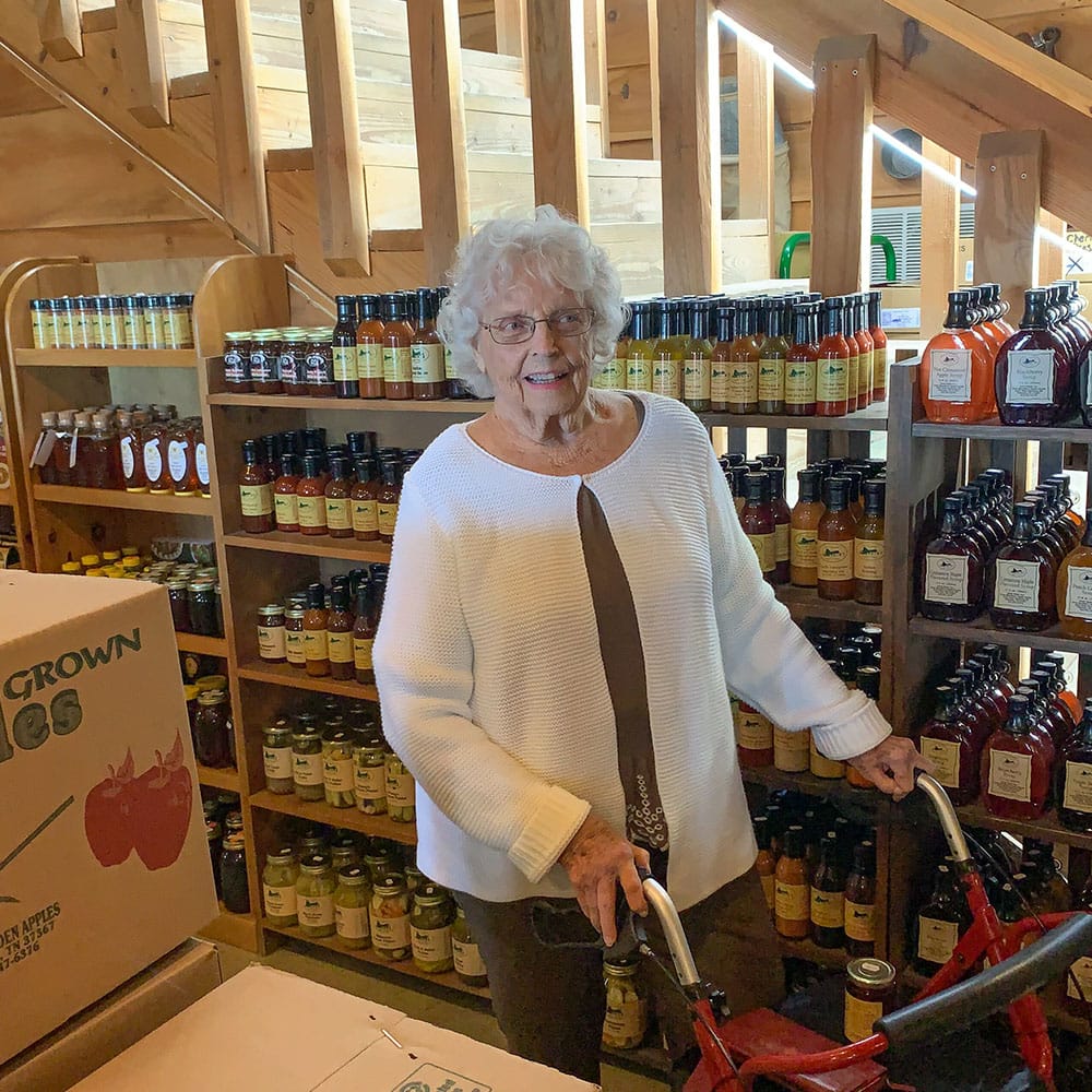Resident smiling in a charming store interior