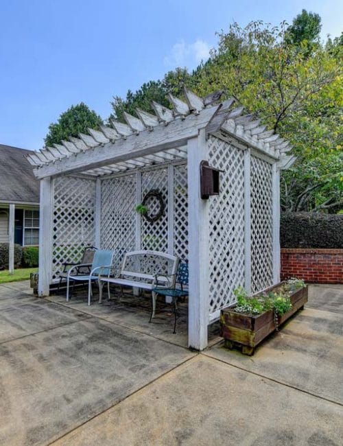 Outdoor seating area with trellis and plants