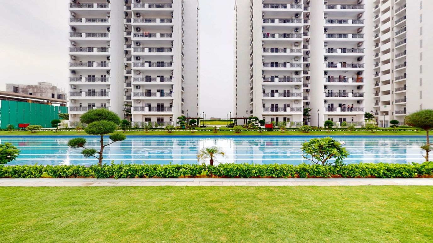 Outdoor view of a swimming pool surrounded by buildings