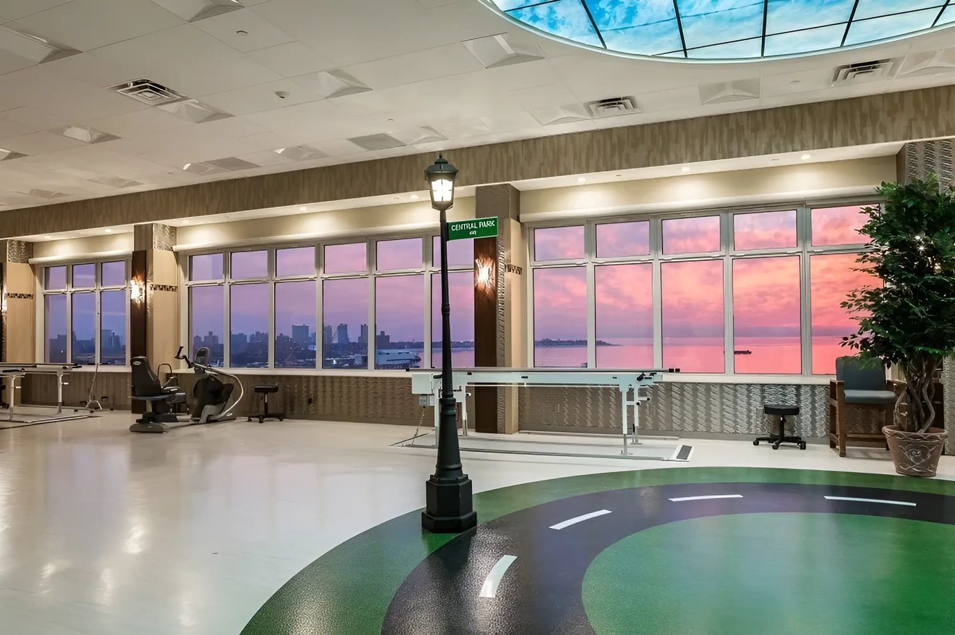 Bright interior space with fitness equipment and large windows