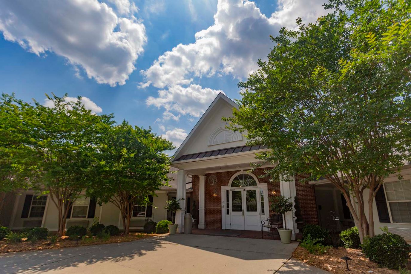Exterior of Rock Hill Post Acute Care Center with lush landscaping