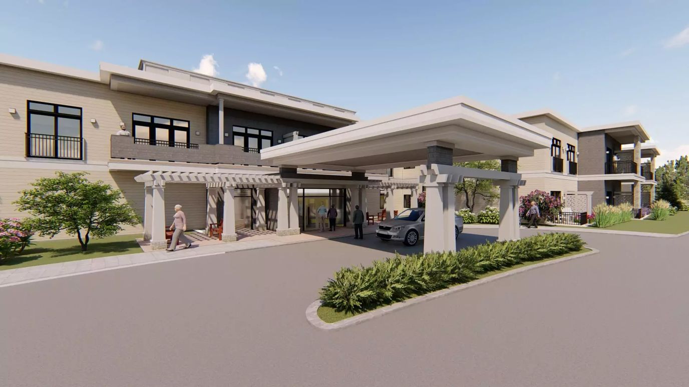 Entrance of a senior living facility with outdoor landscaping