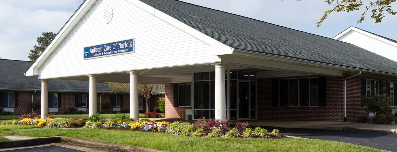 Exterior view of a nursing home with landscaped garden