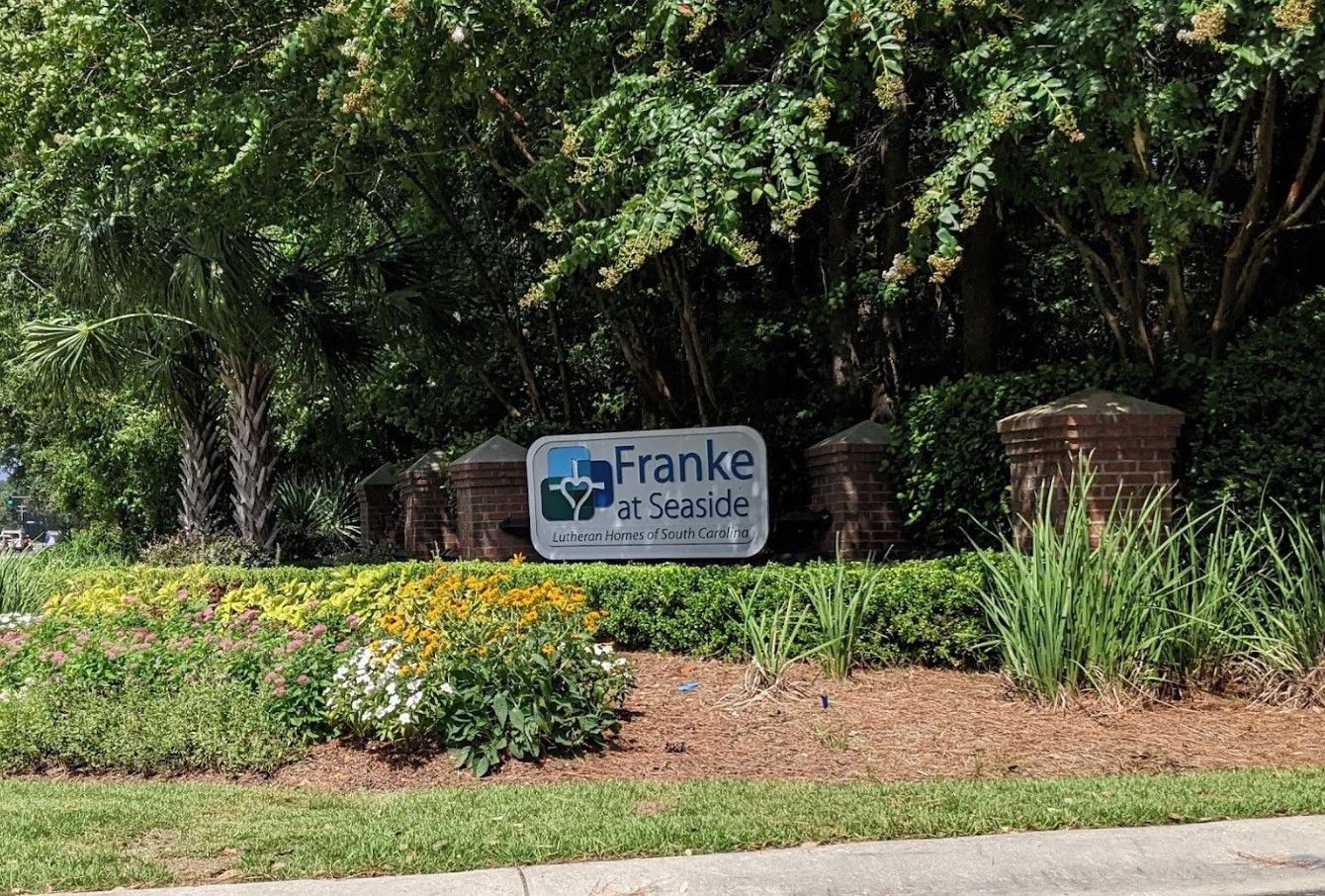 Sign for Franke at Seaside surrounded by greenery