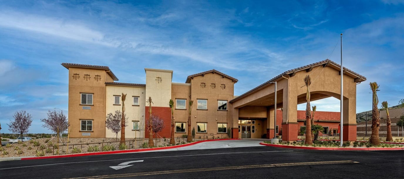 Exterior view of Palm Vista Senior Living facility