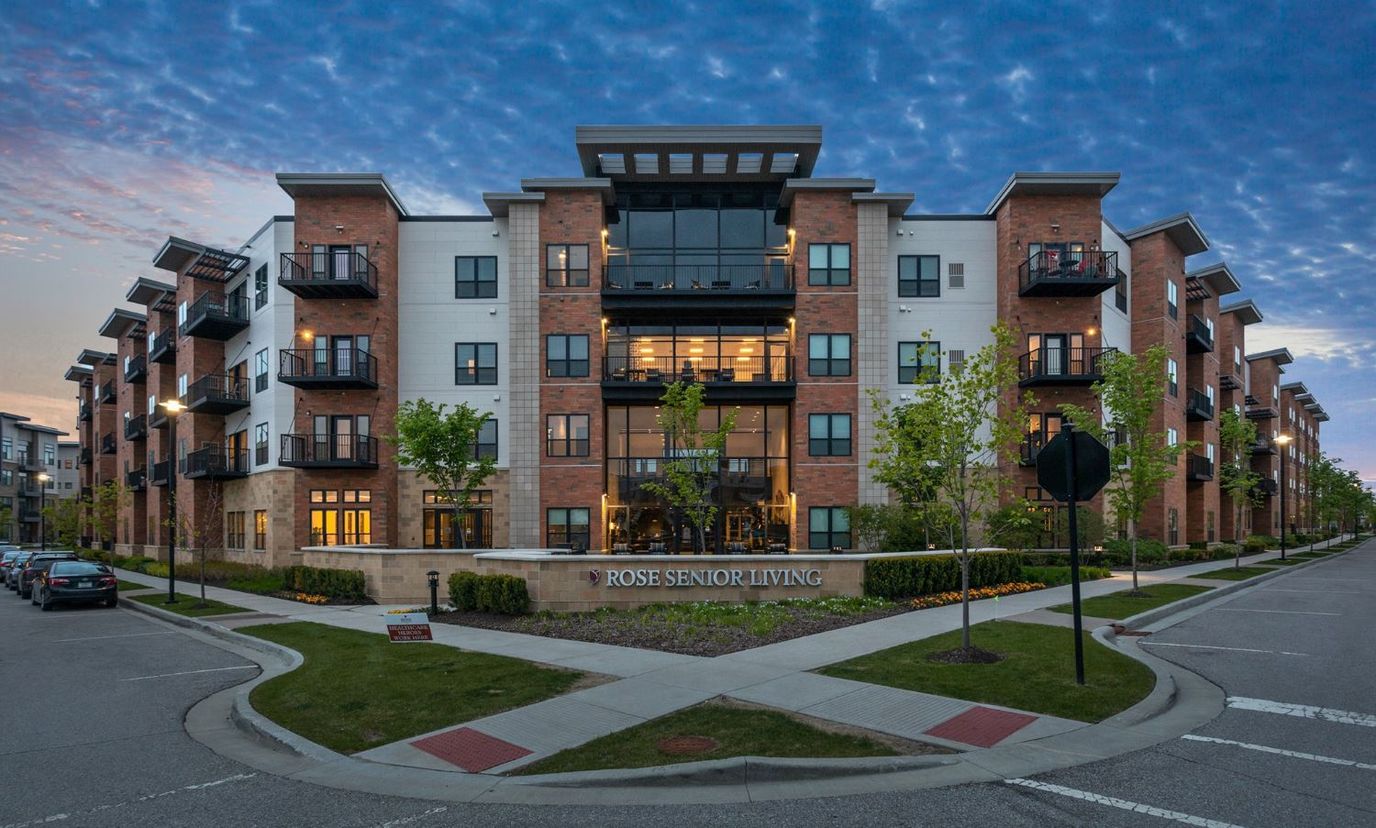 Exterior view of Rose Senior Living Carmel at dusk