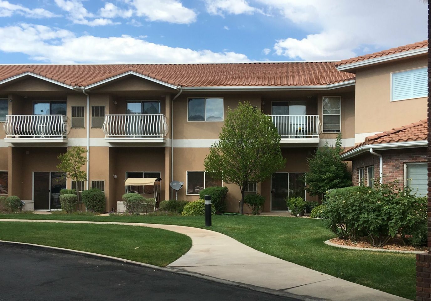 Residential building exterior with landscaped area