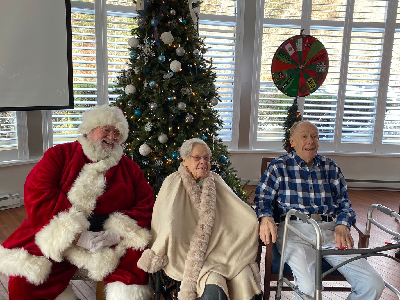 Residents enjoying a holiday celebration with Santa