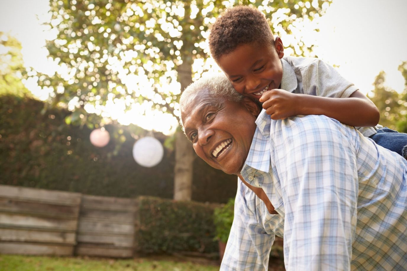 Eden Health – Home Health, Home Care, Hospice, home care in Idaho Falls, ID — Grandfather and grandson playing joyfully in a garden