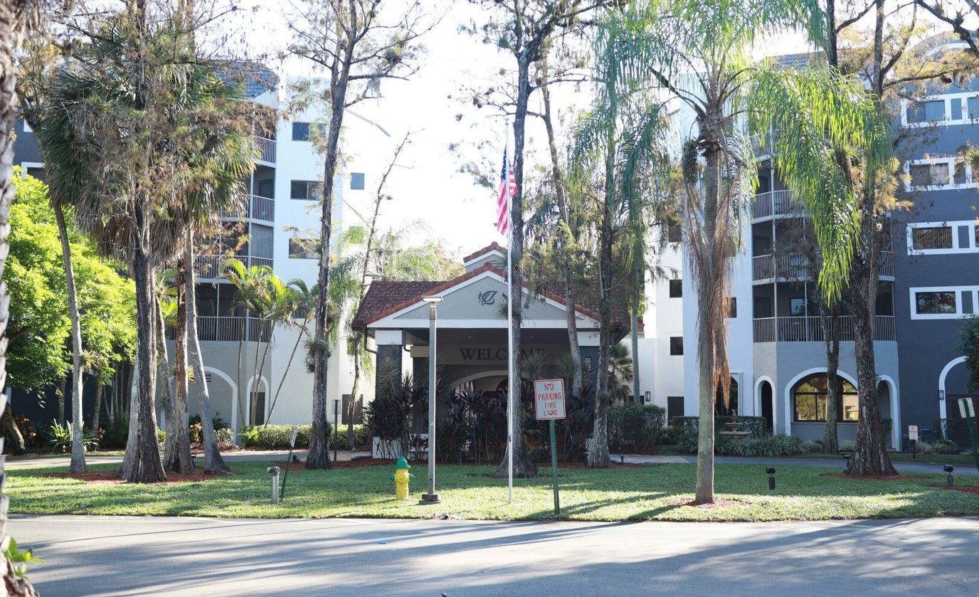 Front entrance of Forest Trace Senior Living surrounded by trees
