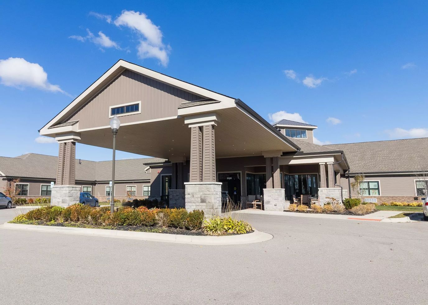 Exterior view of StoryPoint Brighton with landscaped entryway
