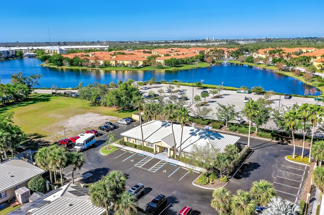Aerial view of Healthpark Senior Living facility by a lake
