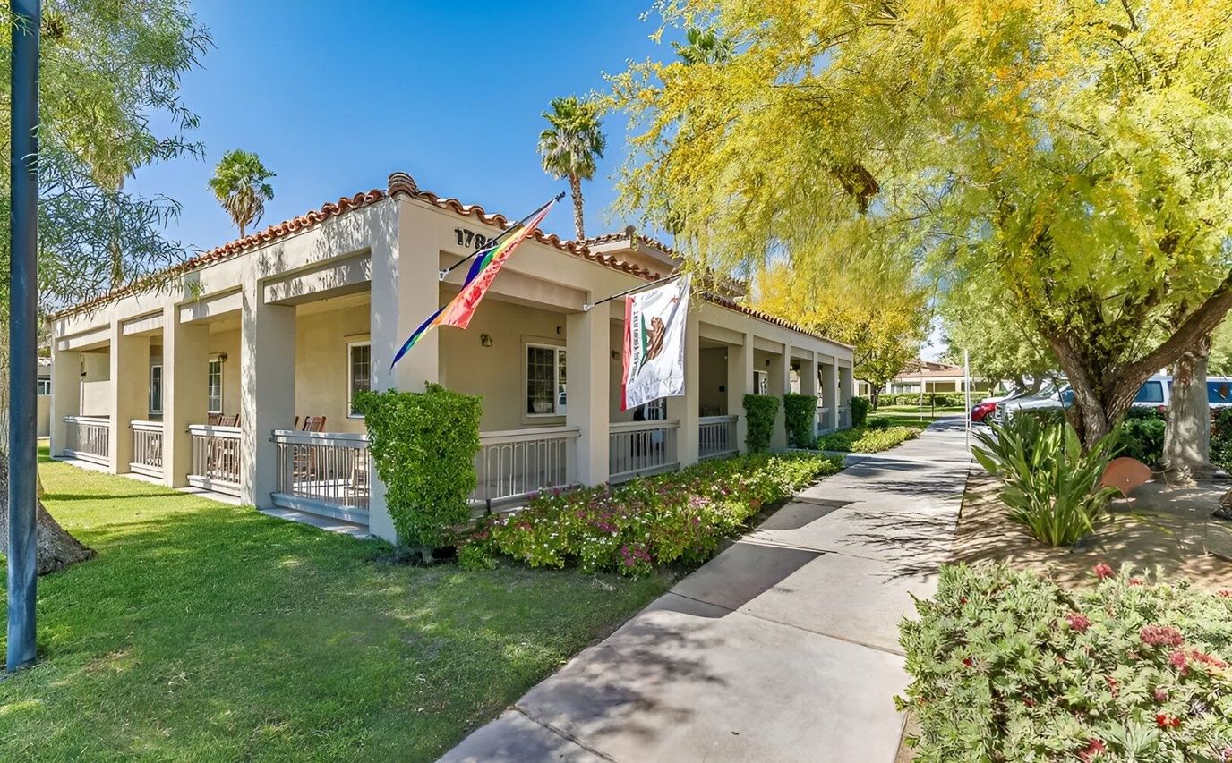 Exterior view of Cottages at Palm Springs with gardens