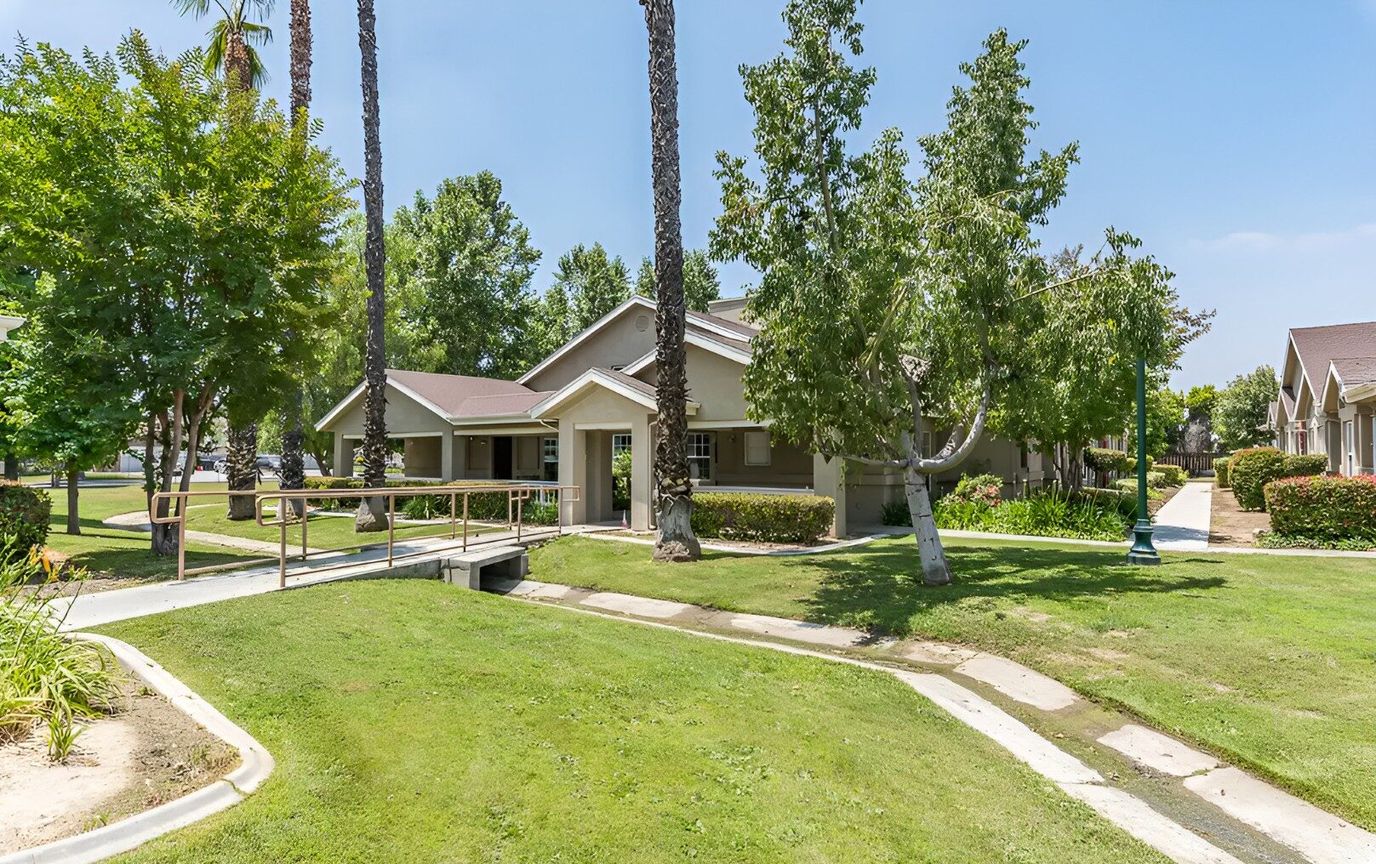 Exterior view of Cottages at Hemet with landscaping