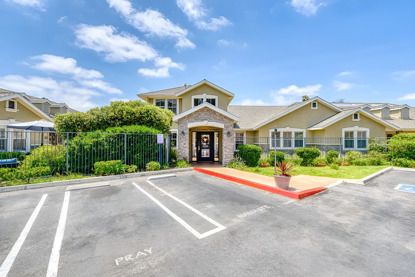 Front entrance of a senior living facility with landscaping