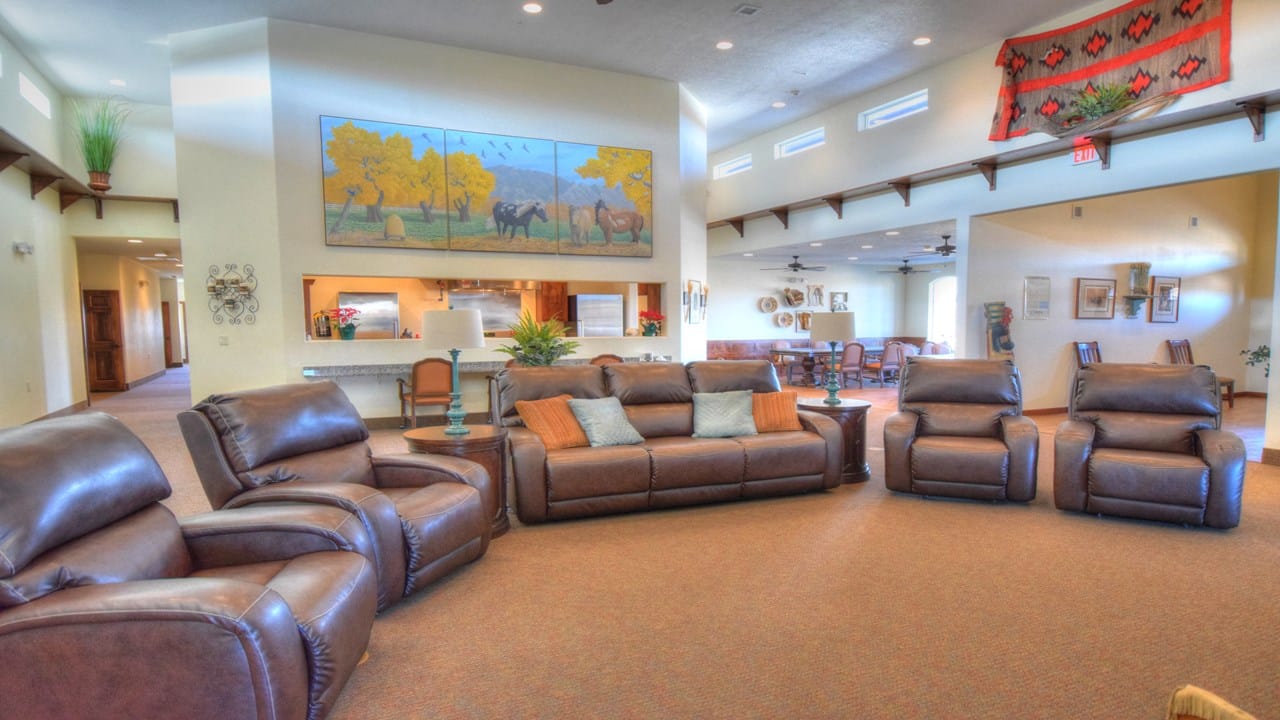 BeeHive Homes of Bernalillo, assisted living in Bernalillo, NM — Comfortable lounge area with leather sofas and artwork